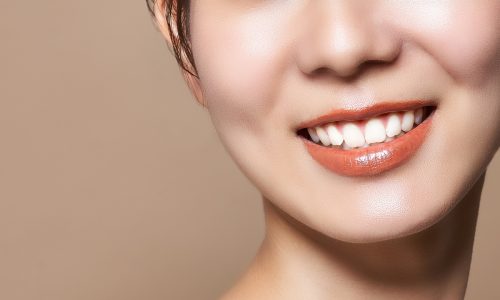 young woman showing bright white teeth